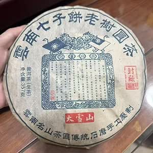 Сырой пуэрный чайный брикет «Снежная гора», 2013 год, 357 г, производства чайной фабрики «Лао Шу», провинция Юньнань.